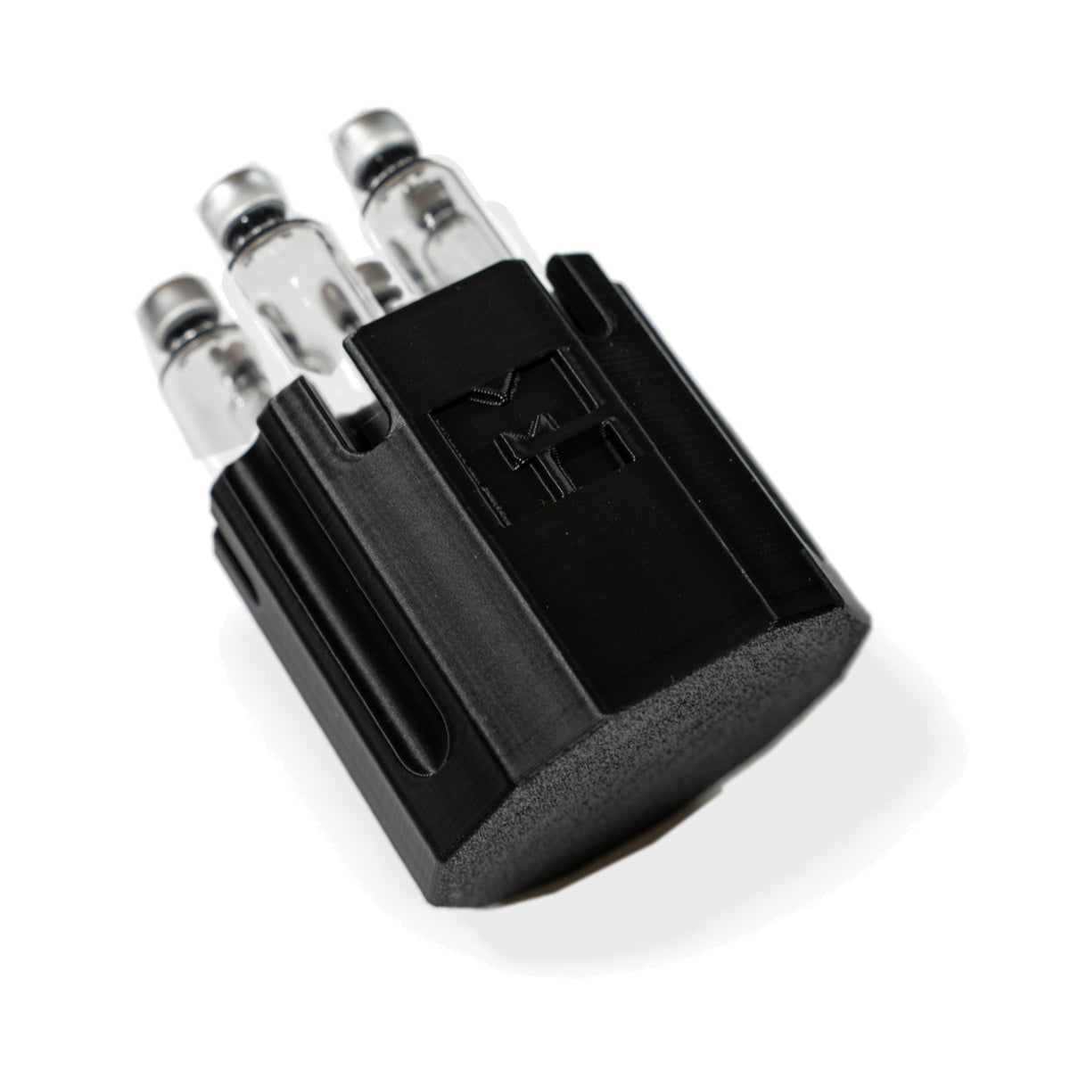 MODTECH purge station holding 3 mL glass cartridges upright, seen at an angle with the M logo forward