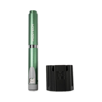 Green MODTECH V2 pen standing beside the black purge station, seen from the side