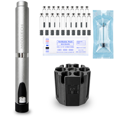 Silver V2 pen with twenty empty 3 mL glass cartridges, a sterilization pouch label, one cartridge sealed in its pouch, and the black purge station