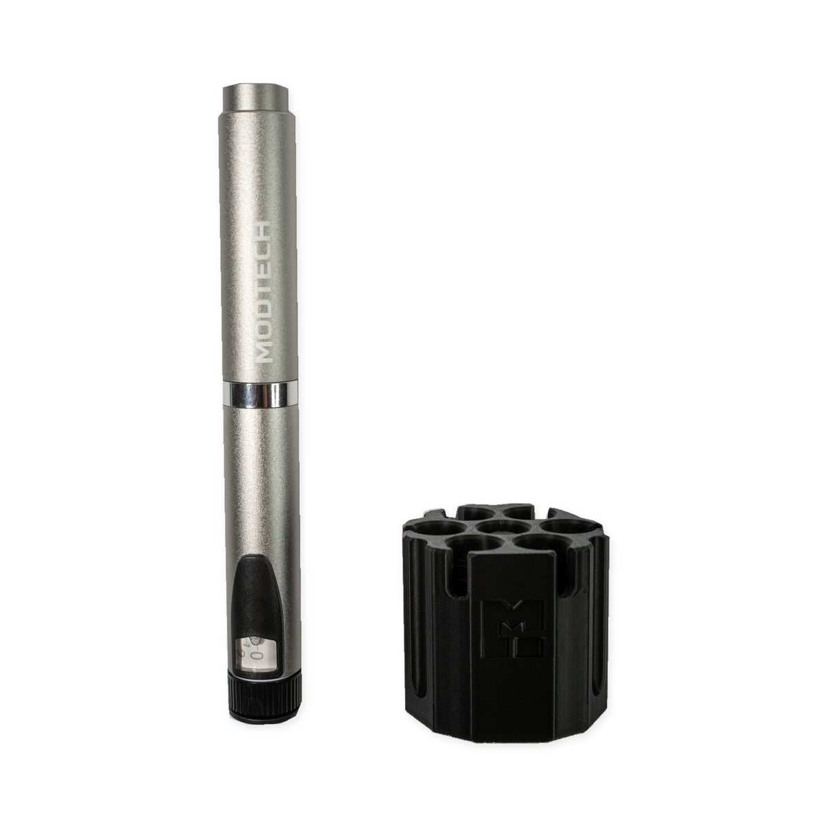 Silver MODTECH V2 pen standing beside the black purge station