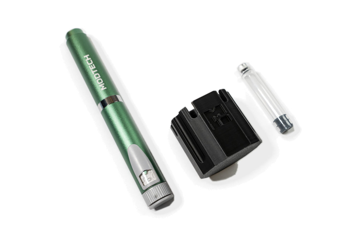 Green MODTECH V2 pen, the black purge station and one 3 mL glass cartridge
